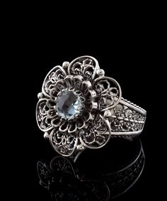 Elevate your femininity with this exquisite 925 Sterling silver ring featuring a delicate yet intricate lace daisy flower design with a stunning Blue Topaz gemstone. Ideal for daily wear, this ring is perfect for special occasions such as weddings, engagements, proms, or any other celebrity events. With its simple yet elegant design, it also makes an excellent gift option for holidays, birthdays, Christmas, mother's day, and any other occasion you can think of! Crafted with high precision and at Celebrity Events, Women Flower, Blue Topaz Gemstone, Statement Ring Silver, Rose Quartz Gemstone, Sterling Silver Filigree, Filigree Ring, Art Blue, Silver Filigree