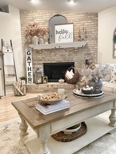 a living room filled with furniture and a fire place in front of a brick wall