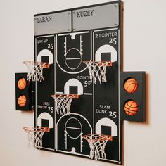 a wall mounted basketball game on a white wall