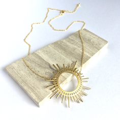 Gold Sunburst Necklace A Large Golden Sunburst Pendant Is The Centerpiece Of This Necklace. It Is Paired With A Delicate Gold Chain & Extender. Fun, Whimsical And Powerful, This Is A Great Everyday Necklace! Excellent Quality Gold Plated Chain & Lobster Clasp, Small Golden Drop At The End Of The Extender. Brass Sun Pendant. Approx. Size: Overall 17"18"L, 1-1/4" Extender, Pendant 1-3/4 "W A Natural & Delicate Necklace. Mystical Witches Statement Necklace! Boho Sun Goddess, Circle Necklace Celestial Style Yellow Gold-plated Necklaces, Elegant Gold Plated Sun Design Necklace, Sunburst Necklace Gold, Celestial Yellow Gold Pendant Necklace, Goddess Circle, Gold Plated Sun Design Pendant Necklace, Sunburst Necklace, Delicate Gold Chain, Gold Sunburst