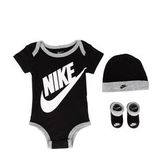 The Nike Futura Logo Infants' Box Set includes a cotton short-sleeve bodysuit with a matching hat and booties for a quick, go-to ensemble that's soft and comfortable. The bodysuit has lap shoulders and snap closures that help make changing and dressing easy. Standard fit for a relaxed, easy feel. Bodysuit/Hat: 100% cotton. Booties: 62% cotton, 34% polyester, 4% elastane. Machine Wash. Imported. Baby Nike Outfits, Nike Bodysuit, Nike Onesie, Baby Boy Nike, Boys Overalls, Baby Nike, Newborn Boy Clothes, Black Overalls, Nike Zip Up