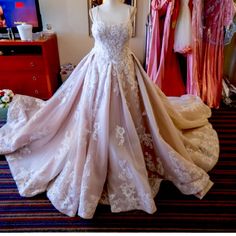 a wedding dress on display in a room