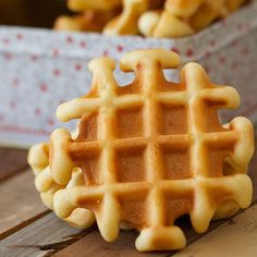 a waffle shaped cookie sitting on top of a wooden table