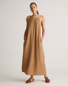 Our 100% Organic Cotton Gauze Sleeveless Maxi Dress is perfect for hot summer days, beach vacations, or evening strolls. With its elegant maxi length and high neck design, this dress ensures you'll look polished and put-together for any occasion. Made of breezy, lightweight organic cotton gauze, this dress will keep you cool all summer long!  | Quince | Women's Gauze Sleeveless Maxi Dress in Toasted Coconut, Size XL, Organic Cotton Look Polished, High Neck Designs, Silk Cami, Beach Vacations, Quarter Zip Sweater, Toasted Coconut, Organic Fabrics, Sleeveless Maxi Dress, Blouse Dress