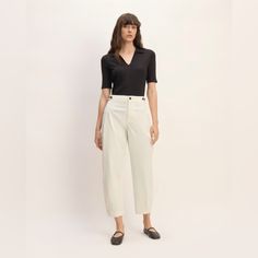 About This Style. This Piece Features A High Rise, Barrel Leg, Regular Length, Zipper Closure, Waistband Buttons On The Side Seams For Adjustability, In Organic Cotton. Fit High-Rise Inseam: 27" Waist Measures Apr. 16” Across Materials 98% Organic Cotton, 2% Elastane Care Machine Wash Cold With Like Colors. Only Non-Chlorine Bleach When Needed. Tumble Dry Low. Warm Iron When Needed. New Without Tags; Never Worn Spring Workwear Tops With High Waist, Versatile Fitted Bottoms For Daywear, Fitted Everlane Bottoms For Spring, Fitted Cotton Bottoms By Everlane, Classic Everlane Bottoms For Spring, Everlane Classic Fitted Bottoms, Chic Cotton Bottoms By Everlane, Everlane Casual High Waist Pants, Chic Everlane Cotton Bottoms