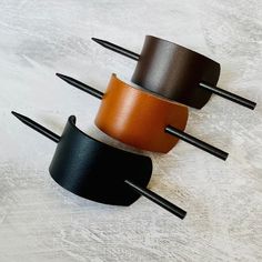 LEATHER HAIR BARRETTE WITH STICK Handmade vegetable tan leather hair barrette with stick. Super versatile for a casual up do - will hold your bun in place effortlessly!  DIMENSIONS Length 12cm  Width 4cm  Wooden Stick - 16.5cm WHILE YOU'RE HERE WHY NOT TAKE A LOOK AT OUR OTHER HAIR ACCESSORIES! https://www.etsy.com/shop/ScarlettSkyStudio?search_query=HAIR+ACCESSORIES Leather Hair Clips, Smartphone Bag, Leather Hair Accessories, Leather Scraps, Diy Book, Gold Leather, Hair Barrettes, Barrettes, Natural Leather