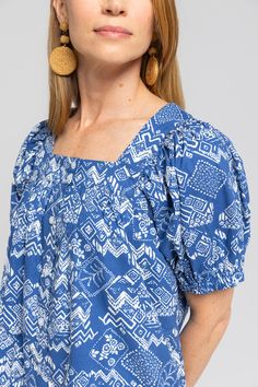 We wanted a casual dress that you could throw on and run out the door. Our Everett dress is the dress you can do anything in. Whether you are running errands, playing with kids, or on a beach trip, this dress is perfect for your everyday. It was designed with a loose oversized fit. We love wearing it as a beach cover up too! Details Geometric paisley print Button placket up the length of the dress Mini Length Pockets Cotton fabric Fit Notes Jacklene takes an XS in this style. Dress is made with Cotton Beachy Dress For Summer Outings, Cotton Beachy Dresses For Summer, Printed Square Neck Vacation Dress, Square Neck Printed Vacation Dresses, Blue Square Neck Maxi Dress For The Beach, Blue Square Neck Maxi Dress For Beach, Printed Square Neck Dress For Vacation, Square Neck Printed Dresses For Vacation, Beachy Blue Short Sleeve Dress