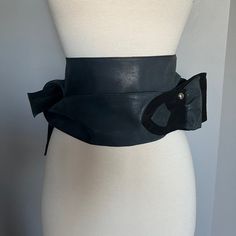 Like A Sash To Be Tied At Will, This Soft Leather Belt Brings In The Waist And Defines An Ultra-Feminine Silhouette. Size Small New, Never Been Worn. Comes With Original Linen Bag 100% Leather High-Waist Belt Soft Shimmer Leather Leather Lining Metal Stud With Logo Height: 3.5 In Lenght: 67 In Elegant Leather Corset Belt For Fall, Black Leather Corset Belt With Self Belt, Black Leather Corset Belt With Belt Detail, Black Leather Corset Belt With Belt Loops, Fitted Black Leather Belt, Chic Leather Corset Belt For Fall, Black Corset Belt For Fall, Black Leather Corset Belt For Evening, Evening Black Leather Corset Belt