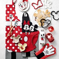 minnie mouse party supplies and decorations on a table