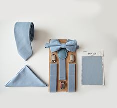 Dusty blue bow tie, suspenders, necktie, and pocket square for newborn up to adult sizes. David's bridal-inspired set is perfect for dusty blue-themed weddings, ring bearers, groom, and groomsmen outfits. Also often bought for boys birthday outfits, cake smash, and family photos. ∙ ∙ ∙ ∙ ∙ ∙ ∙ ∙ ∙ ∙ ∙ ∙ ∙ ∙ ∙ ∙ ∙ ∙ ∙ ∙ ∙ ∙ ∙ ∙ ∙ ∙ ∙ ∙ ∙ ∙ ∙ ∙ ∙ ∙ ∙ ∙ ∙ ∙ ∙ S U S P E N D E R S ∙ - Y-shaped fully adjustable - 3/4 inches wide (skinny suspenders) - Soft and comfortable faux leather - Suspenders come Slate Blue Suspenders, Blue Wedding Theme Ring Bearer, Cheap Blue Suit And Tie Accessories For Wedding, Cheap Blue Ties For Groomsmen Gift, Dusty Blue Bow Tie, Navy Bow Tie, Bow Tie Suit, Boys Birthday Outfits, Blue Suspenders