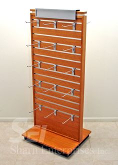 a wooden display case with metal bars on it