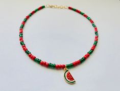 This red and green beaded necklace comes with a watermelon enamel charm, ruby red, and emerald green glass seed beads.  It comes in 4 different lengths - 14, 16, 18, or 20 inches - and every necklace also comes with two additional inches of adjustable extender chain.  This fun necklace is super cute and also makes a great gift! Watermelon Ideas, Watermelon Necklace, Summer Choker, Collar Rosa, M Necklace, Rainbow Keychain, Watermelon Sugar, Green Beaded Necklace, Necklace Ideas