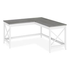 a white and gray coffee table with an x - frame design on the top, in front of a white background