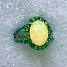 Natural Quality Opal Tsavorite Ring Size 7 14k Gold 5.66 TCW Certified $5,950 300686This is a one of a Kind Unique Custom Made Glamorous Piece of Jewelry!Nothing says, “I Love you” more than Diamonds and Pearls!This item has been Certified, Inspected, and Appraised by Gemological Appraisal LaboratoryGemological Appraisal Laboratory of America is a proud member of:- GIA Alumni Association- National Association of Jewelry Appraisers- International Consortium Gem-Testing Laboratories- Gemological A Oval Multi-stone Tsavorite Rings, Oval Tsavorite Multi-stone Ring, Gia Certified Green Tsavorite Rings, Green Cluster Ring With Halo, Oval Tsavorite Rings With Halo Setting, Green Tsavorite Gemstone Ring, Oval Multi-stone Emerald Ring, Green Multi-stone Opal Anniversary Ring, Green Multi-stone Opal Ring For Anniversary