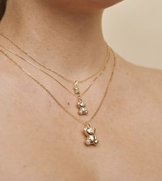 Adorn yourself with the perfect symbol of joy and tenderness, this beautiful 14k Gold Teddy Bear Necklace. Crafted with gleaming 14k yellow gold, it's sure to bring a smile to your face each time you wear it! Classic Everyday Charm Necklaces In 14k Gold Filled, 14k Gold Filled Yellow Gold Charm Necklace For Anniversary, 14k Gold Huggie Jewelry With Charms, Sterling Silver Paperclip Chain Jewelry For Anniversary, Sterling Silver Paperclip Chain Jewelry Gift, Everyday Yellow Gold Sterling Silver Charm Necklaces, Everyday Yellow Gold Or Sterling Silver Charm Necklaces, Everyday Yellow Gold Tarnish-resistant Charm Necklace, 14k Gold Paperclip Chain Jewelry For Anniversary