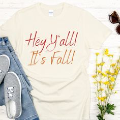 Hey Y'all!  It's Fall!  Cute and simple T-shirt with 2 toned print to make the words stand out.  This basic tee is perfect for fall.  This is an original Fall design which I created, so you will only find it here in my shop. The Gildan 64000 softstyle Unisex Sized T-shirt is very soft, durable and comfortable. * Solid colors are 100% ring-spun cotton * Sport Grey is 90% ring-spun cotton, 10% polyester * Dark Heather is 65% polyester, 35% cotton * Fabric weight: 4.5 oz/yd² (153 g/m²) * Regular Un Fall Graphic Tee With Funny Text, Fall Casual T-shirt With Funny Text, White Tops With Funny Text For Fall, White Funny Text T-shirt For Fall, Antique Silver Earrings, Fall T Shirt, Hey Yall, Its Fall, Fall Country