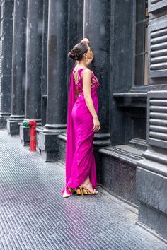 Look bold and elegant in this fusion of Saree Pants adorned with handworked zardozi, resham, dabka, sequins and mukesh to create a perfect symphony! Bright Magenta colored pure chiffon Saree, with a rawsilk blouse and cigarette pants. Glamorous Designer Pre-draped Saree For Navratri, Glamorous Hand Embellished Saree For Festivals, Hand Embellished Silk Pre-draped Saree, Glamorous Silk Choli With Dupatta, Bollywood Style Silk Sharara For Evening, Bollywood Style Hand Embellished Evening Sharara, Bollywood Evening Hand Embellished Sharara, Silk Sharara For Evening Festivals, Silk Sharara For Diwali Evening