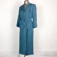 Vintage Fitted Blue Suits, Blue Fitted Vintage Suit, Vintage Blue Skirt Suit For Formal Occasions, Vintage Fitted Skirt Suit With Notch Lapel, Fitted Vintage Blue Suits, Vintage Blue Semi-formal Suits, Vintage Fitted Skirt Suit For Formal Occasions, Fitted Vintage Suits For Workwear, Retro Fitted Suits With Pockets