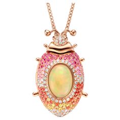 One of a kind lucky beetle necklace in 18 Karat rose gold 26,2g set with the finest diamonds in brilliant cut 0,62Ct (VVS/DEF quality) one natural, opal in oval cabochon cut 5.00Ct, pink and orange, yellow and pink sapphires in brilliant cut 1,45Ct. The feelers and the eyes are set with tsavorites and pink tourmalines in round cabochon cut. The chain is 60 cm long, including an extra eye to make it 5 cm shorter. This lucky beetle is a locket, you can keep your favorite picture inside. Celine Roelens, a goldsmith and gemologist as well, is specialized in unique, fine jewelry, handmade in Belgium and brought to life by experienced craftsmen. Original pieces made from precious materials of exceptional quality. Celine launched "The Goldbeetle” in 2020. The brand name is inspired by the rare an Multi Gem Ring, Beetle Necklace, Yellow Pendant, Sapphire Diamond Pendant, Pink Spinel, Favorite Picture, Orange Sapphire, Antique Necklace, Exclusive Jewelry