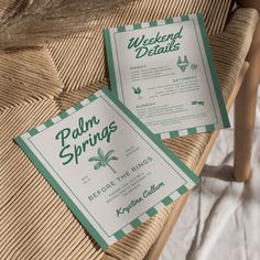 two green and white menus sitting on top of a wicker chair next to each other