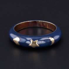 An enchanting gold and enamel band -- perfect for stacking or wearing by itself! This vibrant enamel band (circa 1970-1990) is 14k gold with midnight blue enamel and golden heart, star, and crescent moon accents. The band is a size 6.25 and cannot be re-sized. It is in very good condition. We have many other fantastic offerings of antique and vintage jewelry posted on our Etsy store, so please consider browsing our other items. We send all items in individually packaged gift boxes. + Trademark A Gold Thumb Rings, Bespoke Rings, Golden Heart, Jewelry Post, Enamel Ring, Thumb Rings, Antique Diamond, 14k Gold Ring, Garnet Rings