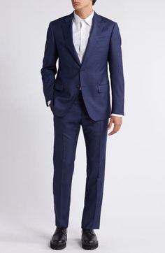 Classic and smart, this wool suit styled in a dark-blue mélange features traditional detailing that makes it a versatile addition to any formal wardrobe. Jacket has notched lapels; chest welt pocket; flap pockets; side vents Trousers have zip fly; slant pockets; back button-welt pockets Jacket is lined; trousers are lined to the knee 100% virgin wool Dry clean Imported Blue Three-piece Suit With Welt Pockets For Business Casual, Blue Notch Lapel Suit In Suiting Fabric, Blue Business Suits With Welt Pockets, Tailored Blue Three-piece Suit For Formal Occasions, Timeless Blue Suit And Tie Accessories For Formal Occasions, Blue Notch Lapel Three-piece Suit For Formal Occasion, Blue Three-piece Suit With Notch Lapel For Formal Occasion, Timeless Blue Suit In Suiting Fabric, Blue Semi-formal Suit