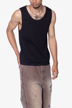 the Waffle Knit Tank is a 100% cotton tank is perfect as a base layer or worn alone. the tank features taping at the neck and arm openings, a flat hem, and is constructed in a ribbed material. details flat hem 100% ribbed cotton fabric Model is 6’0, 140 lbs and wears a size medium Casual Ribbed Tank Top For Streetwear, Stretch Ribbed Tank Top For Streetwear, Urban Crew Neck Cotton Tank Top, Urban Cotton Crew Neck Tank Top, Urban Style Cotton Crew Neck Tank Top, Cotton Stretch Tank Top For Streetwear, Casual Ribbed Vest With Tank Straps, Casual Cotton Ribbed Tank Top, Casual Ribbed Cotton Tank Top