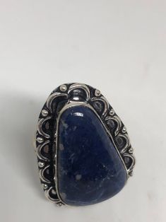 Large genuine blue Lapis Lazuli Vintage ring Low content silver not sterling. Size 9 Can be re sized. My jeweler charges $10-$20 All rings are shipped free in the US in a nice gift box. Check out our over a THOUSAND great reviews Engraving is $4 per letter and is not always perfect depending on the piece. It can take a few days if the jeweler is busy. This is payable to Paypal Judithsltd@gmail.com Adjustable Blue Sapphire Open Ring, Blue Open Ring Jewelry For Gift, Bohemian Blue Collectible Ring, Collectible Blue Gemstone Ring, Adjustable Blue Rings With Large Stone, Classic Adjustable Blue Rings, Silver Sapphire Ring With Large Stone As Gift, Blue Large Stone Ring Jewelry, Handmade Blue Sapphire Ring As A Gift