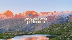 a mountain range with the words progress over perfection on it