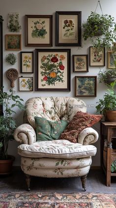 a living room filled with lots of plants and pictures hanging on the wall above it