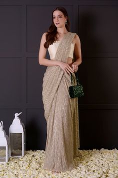 Gold pre-draped saree in imported shimmer base. Comes with an ivory bamberg silk blouse with leaf and pearls hand embroidered neckline. - Aza Fashions Gold Saree, Embroidered Leaf, Draped Saree, Embroidered Leaves, Drape Saree, Embroidered Neckline, Blouse For Women, Fashion App, Buy Gold