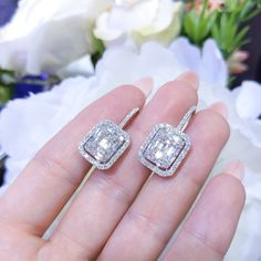 Very high quality round and baguette diamonds in a prong set cluster, surrounded by a diamond halo. All jewelry sales come with an appraisal including replacement value. Carat Range 2.0-2.5 Clarity VS2-SI1 Color F-G Cut Bagutte, Round GemStone Diamond - April Material 14k White Gold Shop Prong, Diamond, Fashion, Dangle Luxury Diamond Earrings With Baguette Cut Halo Design, Dazzling Baguette Cut Diamond Earrings, Diamond White Baguette Cut Halo Earrings, Diamond White Baguette Cut Earrings With Halo Design, Gia Certified Baguette Cut Diamond Earrings, Diamond Emerald-cut Halo Earrings, Emerald Cut Diamond Earrings With Halo Setting, Dazzling Baguette Cut Diamond Earrings For Anniversary, Emerald Cut Diamond Earrings With Halo Design