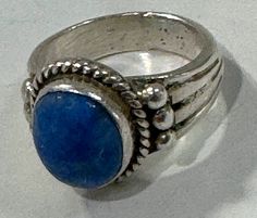 Beautiful, vintage Native American rare small in size but mighty in feel denim lapis ring.   This vintage lapis (the color of denim) ring is really pretty and a rare vintage find!  This is a small sized ring with a big size stone and heavy metal weight.  It measures a US Size 3 3/4.  It is a wonderful pinky ring.   I don't size rings but assume these could be easily sized by your local jeweler since they are sterling silver.  This natural lapis stone ring is unmarked but tests as silver.  I have Vintage Lapis Lazuli Round Jewelry, Vintage Blue Opal Ring For Gift, Vintage Style Blue Opal Ring Gift, Vintage Blue Opal Ring Gift, Vintage Blue Rings With Stone Setting, Vintage Blue Ring With Large Stone, Vintage Blue Lapis Lazuli Ring, Vintage Blue Cabochon Ring, Adjustable Blue Cabochon Moonstone Ring