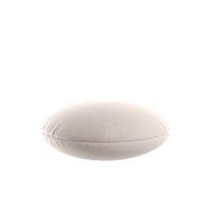 a white pillow sitting on top of a table