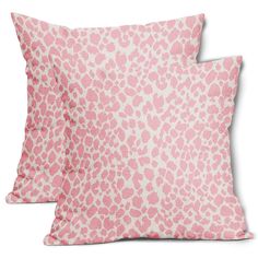 two pink leopard print pillows on white background