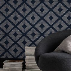 Add luxury and glamour to your walls with Deco Triangle Navy wallpaper. This glamorous wallpaper design features a maxi geometric triangle pattern in statement silver metallic on a deep navy blue background. This luxurious statement design is printed on a fibrous paper that adds subtle texture and dimension to any living space. Graham & Brown 11-in Navy Blue Non-woven Textured Geometric 56-sq ft Unpasted Paste The Wall Wallpaper Sample | 11827294 Modern Wallpaper Accent Wall Navy Metallic, Navy Geometric Wallpaper Bedroom, Navy Art Deco Wallpaper, Modern Geometric Navy Wallpaper, Art Deco Navy And Gold Palm Wallpaper, Glamorous Wallpaper, Navy Wallpaper, Graham & Brown, Navy Blue Background