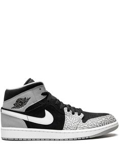 Air Jordan 1 Mid SE sneakers from JORDAN featuring black, grey, white, leather, signature Swoosh logo detail, signature Air Jordan Wings logo, contrasting panel detail, round toe, front lace-up fastening, logo patch at the tongue, branded insole and rubber sole. These styles are supplied by a premium sneaker marketplace. Stocking only the most sought-after footwear, they source and curate some of the most hard to find sneakers from around the world.. | Jordan Mid SE sneakers Jordan 1 Elephant Toe, Jordan 1 Elephant, Jordan Mid, Jordan Wings, Air Jordan 1 Mid Se, Wings Logo, Swoosh Logo, Print Sneakers, Air Jordan 1 Mid