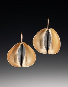 A truly unique earring design. Rich 18K gold bi-metal is formed into an intriguing, stylized pear shape, enhanced with a deep gray patina. These earrings hang just below your ear lobe and move when you do. Approximately 1 inch from top of ear wire to bottom and from side to side. Gold Fusion Earrings With Oxidized Finish, Unique Teardrop Oxidized Earrings, Unique Teardrop Earrings With Oxidized Finish, Gold Teardrop Earrings With Oxidized Finish, Unique Gold Teardrop Earrings For Pierced Ears, Modern Gold Earrings With Oxidized Finish, Contemporary Jewelry Earrings, Unique Earring, Pear Earrings