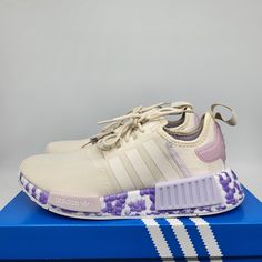 Adidas Originals Women's Nmd_r1 Running Shoes Size 8 Wonder White / Wonder White / Purple Tint Brand New With Box The Adidas Nmd Shoes Aren't Tied To Any One Era. They're Based On '80s Running Designs, Infused With Technology From Today And Then Turned Up With Style Fit For The Future. So When You Step In, It's Kind Of Like You're Time Traveling. Wherever You Wear Yours, You Can Count On Feeling Comfortable Thanks To The Plush And Responsive Boost Midsole That Gives Back Energy With Every Step You Take. Made With A Series Of Recycled Materials, This Upper Features At Least 50% Recycled Content. This Product Represents Just One Of Our Solutions To Help End Plastic Waste. Adidas Purple Sneakers With Round Toe, Purple Adidas Sneakers With Round Toe, Purple Adidas Sneakers, Adidas Purple Running Shoes With Boost Midsole, Purple Sneakers With Boost Midsole For Spring, Adidas Purple Lace-up Running Shoes, Spring Purple Sneakers With Boost Midsole, Casual Purple Adidas Running Shoes, Purple Lace-up Spring Running Shoes