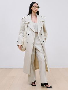 This is a trendy and feminine trench coat by BLOSSOM H COMPANY that is made out of high quality and sturdy material. With distinctive mood of the design and modern feminine look, you can style it for your casual daily outfit.- Feminine mood and high quality fabric- Double breasted closure- Shoulder padding detail- Oversized silhouette Modern Belted Spring Outerwear, Neutral Double-breasted Outerwear For Spring, Chic Neutral Double-breasted Outerwear, Spring Modern Outerwear With Hidden Button Closure, Modern Spring Outerwear With Hidden Button Closure, Chic Gabardine Outerwear For Office, Chic Double-breasted Gabardine Outerwear, Modern Double-breasted Spring Outerwear, Chic Office Outerwear In Gabardine