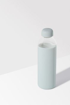 a white bottle sitting on top of a table