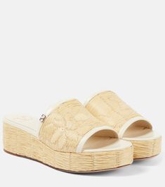 Luxury Slip-on Slides For Spring, Beige Open Toe Slides With Rubber Sole, Cream Sandals With Rubber Sole For Beach, White Slides With Cork-bed Midsoles For Spring, Luxury Summer Slides With Rubber Sole, Beige Straw Sandals With Textured Sole, Elegant Spring Slides With Rubber Sole, Beige Slides With Leather Sole And Round Toe, Luxury Platform Slides For Summer