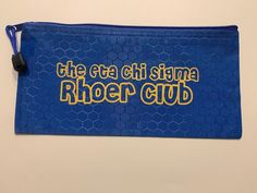 Shower your newly inducted Rhoer with these 5 items. A pencil case, personalized pen or pencil, photo frame, notebook and bookmark.  This pencil case can comfortably hold 15 pens or pencils. Blue Pencil Case With Zipper Closure As Gift, Blue Pencil Case With Pen Slots For Students, Blue Pencil Case With Zipper Closure, Student Pencil-shaped Pencil Case With Zipper, Personalized Multicolor Pencil-shaped Pencil Case, Personalised Pens, Backpack Purse, Personal Touch, Pencil Case