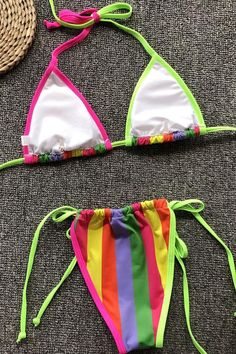 Cute two piece swimsuit featuring a sliding triangle bikini swim top with pad cups, adjustable straps tied on neck and back, and a pair of ruched bikini bottom with tied side string in cheeky fit. Allover in contrast color.Size Guide:Size (in)USBustWaistHipS4-631-3324-2635-37M8-1033-3526-2837-39L12-1435-3728-3039-41 Nylon Swimwear With Drawstring For Beach Season, Beach Season Swimwear With Adjustable Straps And Tie-side Bottom, Adjustable Straps Tie-side Bottom Swimwear For Beach Season, Adjustable Multicolor T-back Swimwear, Multicolor T-back Swimwear For Sunbathing, Multicolor T-back Swimwear For Beach Party, Multicolor T-back Swimwear For Beach, Multicolor String Swimwear For Poolside, Multicolor T-back Swimwear