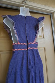 "Vintage 70s hand made denim dress size XS. Very small please see measurements. In great vintage condition. measurements taken across front lying flat N/A armpit to armpit 12\" across empire waist 26\" across hips 54\" length shoulder to bottom" Fitted Denim Blue Bohemian Dress, Fitted Bohemian Denim Dress In Cotton, Fitted Bohemian Cotton Denim Dress, Vintage Cotton Denim Mini Dress, Vintage Medium Wash Summer Dress, Indigo Fitted Denim Dress With Short Sleeves, Fitted Vintage Blue Denim Dress, Vintage Cotton Dress In Dark Wash, Fitted Blue Vintage Denim Dress