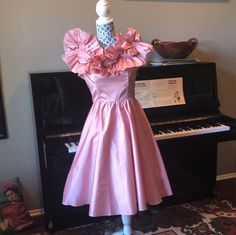 "This is too cute for words. It's a 80's does 50's pink, taffeta-like, off-the-shoulder party dress. The collar has hidden elastic to hug the shoulders and details with perfect roses. Excellent condition! Looks like side panels may have been added but I can't tell as the color and stitching is very well done. There is a small, faint stain in front, hides in the folds (see pic) Sooooo perfect.  28\" waist 34\" top 24\" from waist to hem." Pink Vintage Dress For Costume Party, 1950s Style Pink Vintage Party Dress, 1950s Style Pink Vintage Dress For Party, 1950s Style Pink Party Vintage Dress, 1950s Style Pink Party Dress, Vintage Pink Dress With Fitted Bodice For Party, Pink Vintage Dress With Fitted Bodice For Party, Amanda Garcia, 80s Party Dress