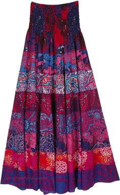 A dreamy, vibrant, and eclectic rayon piece that can be worn as a dress or a skirt.  With its smocked waist, the piece sits well on the waist or the chest. #tlb #TieredSkirt #vacationclothing #beachwrap #Floral #Printed #TieredSkirtDress #SummerDress Multicolor Tiered Skirt Dress With Smocked Bodice, Bohemian Skirted Dresses With Elastic Waistband, Multicolor Gathered Skirt Dress For Spring, Bohemian Tiered Dress With Relaxed Skirt, Bohemian Dress With Relaxed Tiered Skirt, Multicolor Gathered Skirt Dress For Summer, Multicolor Gathered Skirt Summer Dress, Multicolor Summer Dress With Gathered Skirt, Summer Multicolor Dress With Gathered Skirt