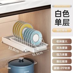 the dish rack is organized with dishes and pans