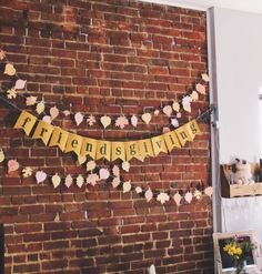 a brick wall with a sign that says friendslive hanging from it's side