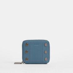 Say hello to the perfect everyday wallet - that fits inside all of your favorite styles. This compact carry-all has dedicated spaces for cards and bills, plus a secret expandable pocket that's ideal for loose keys or a chapstick. Inspired by carefully selected artworks in a gallery show, our Curated Blue leather is a true mid-tone blue, featuring subtle grey undertones. Enjoy gunmetal hardware and a touch of added thickness. Crafted with a true mid-tone blue pebble leather, featuring subtle grey Modern Rectangular Coin Purse With Card Slots, Modern Rectangular Coin Purse With Interior Card Slots, Modern Compact Coin Purse, Modern Coin Purse With Card Slots, Modern Rectangular Coin Purse With Rfid Blocking, Modern Blue Rectangular Card Holder, Modern Rfid Blocking Coin Purse As Gift, Modern Rfid Blocking Coin Purse For Personal Use, Modern Coin Purse With Rfid Blocking For Personal Use